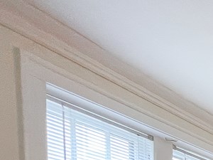 a dining room with a table and chairs and a ceiling fan